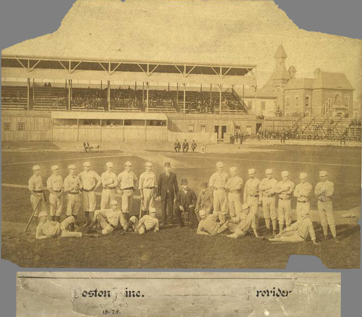 Baseball history photo: 1879 - Messer Park Providence, Rhode Island. Taken in the spring of 1879, this photo shows the 1878 National League Champion Boston Red Caps on the left and the Providence Grays on the right, who were the National league champions in 1879. Messer Park opened in 1878 and had a seating capacity of 6,000. A wire screen was installed behind home to protect the spectators from foul balls and the field was exceptionally smooth for it's time. Note the chalked four foot by six foot pitcher's box, with its front line 50 feet from home base, marked on the field. A few players are identifiable.  For Boston (L to R): Tommy Bond, Pitcher (standing, third from left); John Morrill, Third Base (standing, fifth from left); Charley Jones, Left Field (left of Morrill) and Manager Harry Wright is seated in the dark suit.  For Providence (L to R): Bobby Mathews, Pitcher (first standing); Jim O'Rourke, Right Field (standing, third from left); Joe Start, First Base (standing, fourth from left); John M. Ward, Pitcher (standing, fifth from left);  Paul Hines, Centre Field (standing, far right) and George Wright, Short Stop (reclining, middle). Click photo to return to previous page.