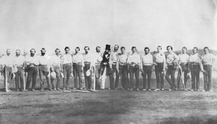 Baseball history photo: This photograph, taken by Brooklyn photographer Charles H. Williamson, depicts the Knickerbocker Base Ball Club and the Excelsior Base Ball Club in one of the earliest known team photos and perhaps the first image on a baseball field.  It was taken on September 3, 1859, at Elysian Fields, Hoboken, New Jersey.  Some of the players are as follows; Knickerbockers—James Whtye Davis (second from left), Charles Schuyler De Bost (third from left) and Harry Wright (sixth from the left).  The umpire is Dr. J.B Jones (middle in overcoat and hat) and the Excelsiors are—Henry D. Polhemus (Jones's left), John Holder (Sixth from right), Edwin Russell (fifth from right) and Thomas Reynolds (far right). Click photo to return to previous page.