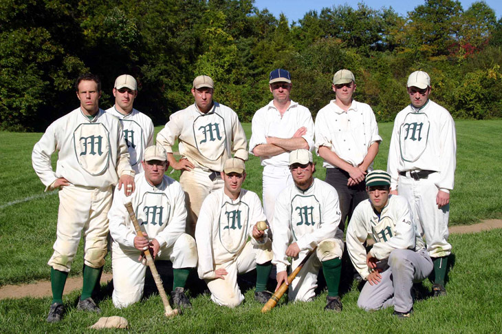 Vintage baseball photo: 10/08/06 - The New York Mutuals at Old Bethpage Village Restoration.  Standing (L to R): Eric “Express” Miklich, Rich “Canada” Harinsky, Ray “Youngblood” Hippeli, Chris “Chops” Lamb, Pete “Wheels” Halecky, Tom “Kick” Halecky.  Front Row (L to R): Tom “Rabbit” Blair, Tom “Squid” Jordan, Tom “Dirt” Fioriglio, Alex “Guppy” Banyazs.  Photo by Bill Staskel.   Click photo to return to previous page.