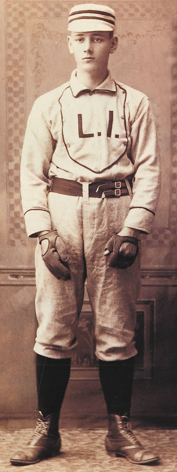 Baseball history photo: Catcher circa 1890.  Note the fact that this player is wearing two gloves and the fingerless glove, used on the throwing hand, indicates that he threw left-handed, which perhaps not an odd site in the 19th century.  Click photo to return to previous page.