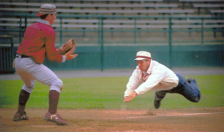 Vintage baseball photo: June 12, 1998: Eric “Express” Miklich sliding home for the Brooklyn Atlantics (NY) in an 1887 rules match against the Glen Head Zig Zags (NY) on Doubleday Field in Cooperstown, New York.  Photo by Tom Ferrara.  Click photo to return to previous page.