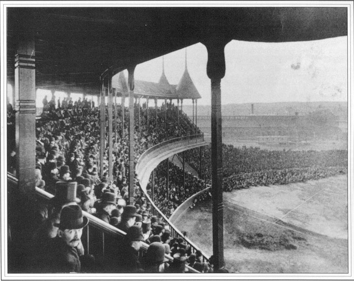 Baseball history photo: Photo taken on Opening Day of the Grand Pavilion of South End Grounds, Boston, May 25, 1888, by Augustine H. Folsom.  The dimensions of the outfield were 250 feet from home base in left field, 445 feet in left center, 500 feet to straight away center field, 440 feet in right center and 255 feet in right field.  This majestic park was a casualty of the Great Roxbury Fire on May 16, 1894.  The fire started in the right field bleachers in the bottom of the third inning of a Beaneaters - Orioles match and also destroyed 177 homes in the area. Click photo to return to previous page.